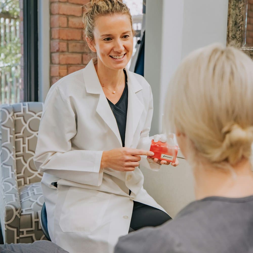 A Meridian dentist explaining treatment to a patient